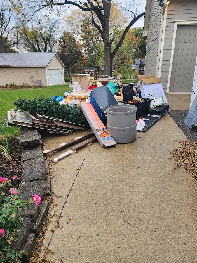 Dumpster being loaded with debris for 10 Yard Dumpster Rental in East Haddam